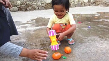Splashy Balloon Fun with Little Explorers on a Sunny Day